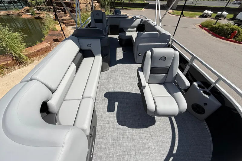 Slide: The Image of 2026 Sun Tracker SportFish 20 DLX pontoon boat with spacious seating and modern design. - 4