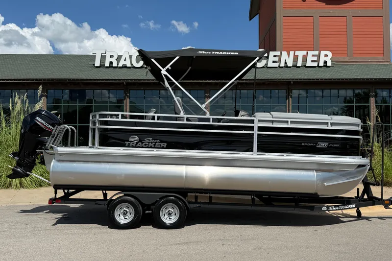 Slide: The Image of 2026 Sun Tracker SportFish 20 DLX pontoon boat on trailer outside dealership. - 8