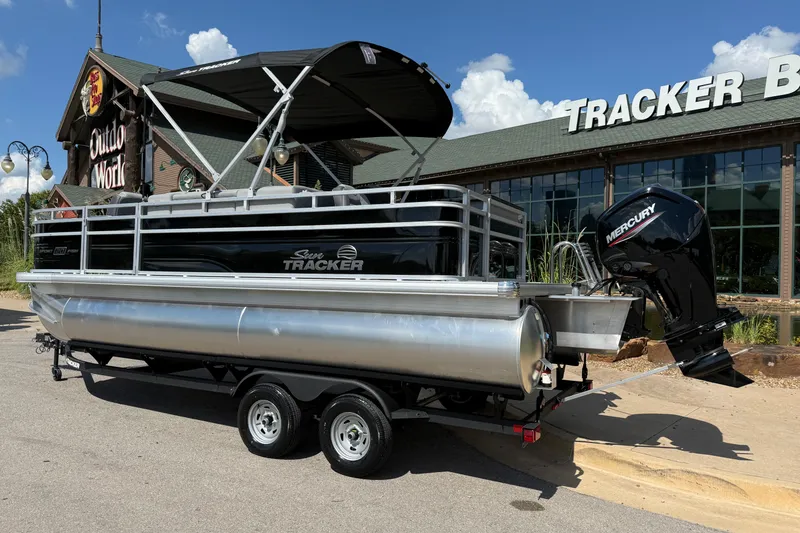 Slide: The Image of 2026 Sun Tracker SportFish 20 DLX pontoon boat with Mercury engine at outdoor store. - 3