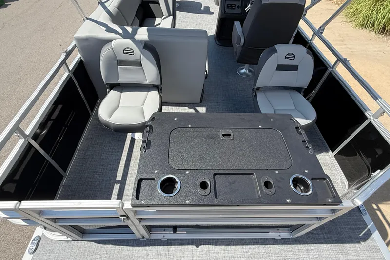 Slide: The Image of 2026 Sun Tracker SportFish 20 DLX pontoon boat interior with seating and fishing station. - 7