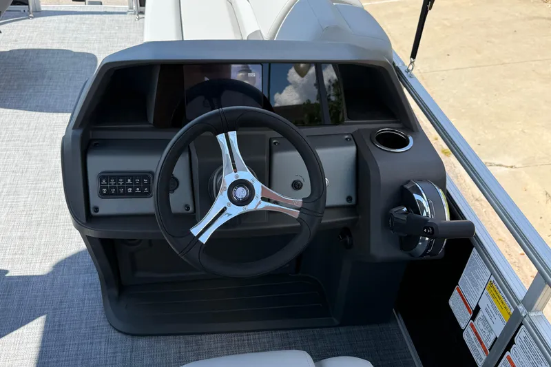 Slide: The Image of 2026 Sun Tracker SportFish 20 DLX steering console with modern controls and cup holder. - 5