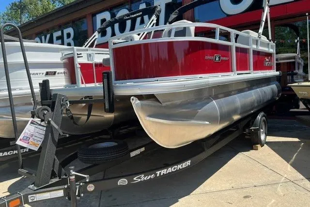 The Image of 2026 Sun Tracker Bass Buggy 16 XL Select pontoon boat on trailer. - 0