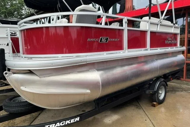 The Image of 2026 Sun Tracker Bass Buggy 16 XL Select pontoon boat on trailer. - 0