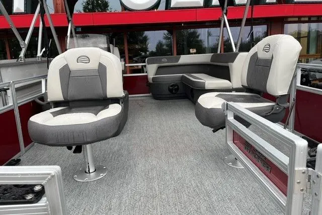 Slide: The Image of 2026 Sun Tracker Bass Buggy 16 XL Select pontoon boat interior with cushioned seating. - 10