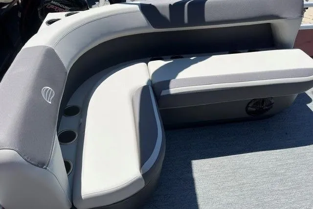 Slide: The Image of 2026 Sun Tracker Bass Buggy 16 XL Select boat seating with cup holders. - 5