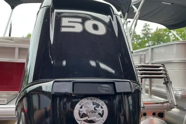 Slide: The Image of Outboard motor on 2026 Sun Tracker Bass Buggy 16 XL Select pontoon boat. - 6