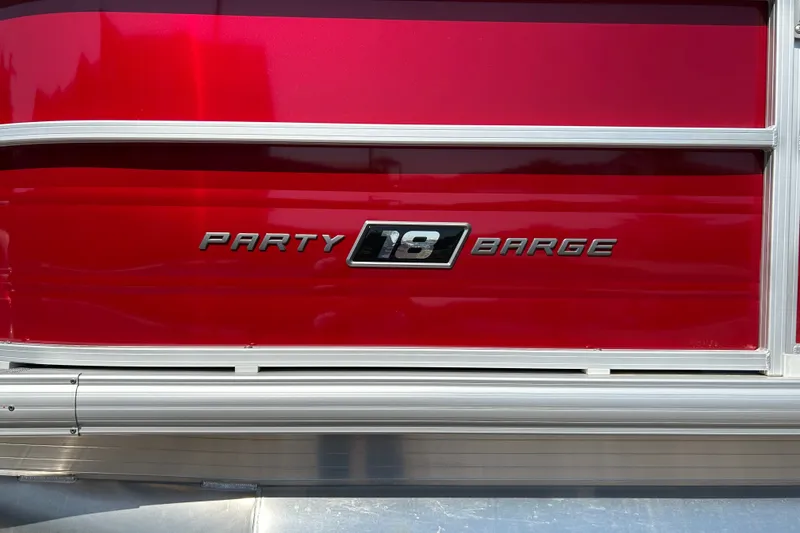 Slide: The Image of 2026 Sun Tracker Party Barge 18 DLX, red exterior with silver trim. - 22