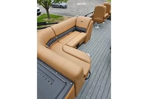 Slide: The Image of 2026 Ranger 220FC boat with tan seating and spacious deck. - 61