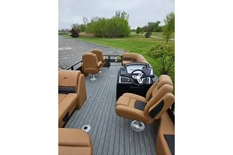 Slide: The Image of 2026 Ranger 220FC boat with tan seating and sleek deck design. - 64