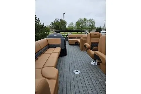 Slide: The Image of 2026 Ranger 220FC boat interior with tan seating and gray flooring. - 66