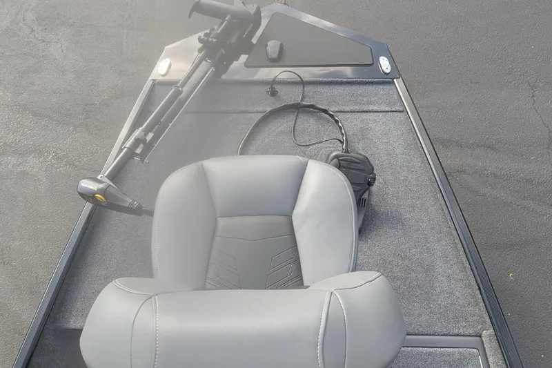 Slide: The Image of 2026 Tracker Bass Tracker Classic XL boat interior with gray seating and trolling motor. - 8