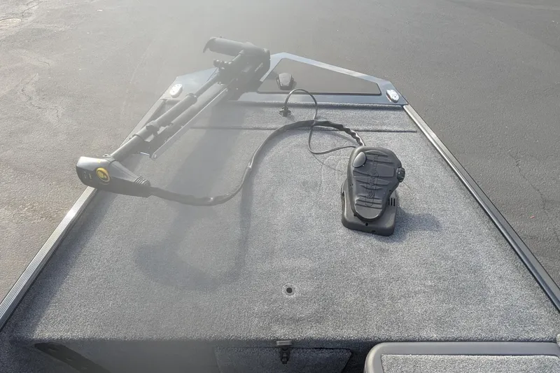 Slide: The Image of 2026 Tracker Bass Tracker Classic XL boat deck with trolling motor and foot pedal. - 7