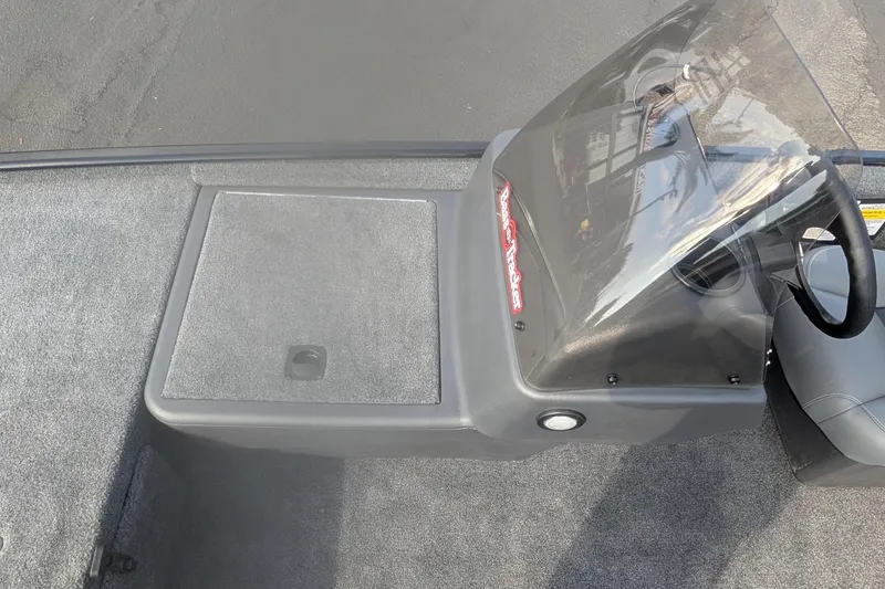 Slide: The Image of 2026 Tracker Bass Tracker Classic XL boat console with windshield and storage compartment. - 9