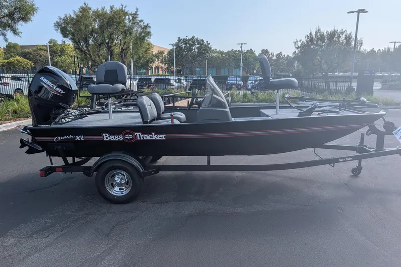 The Image of 2026 Tracker Bass Tracker Classic XL boat on trailer, parked outdoors. - 0