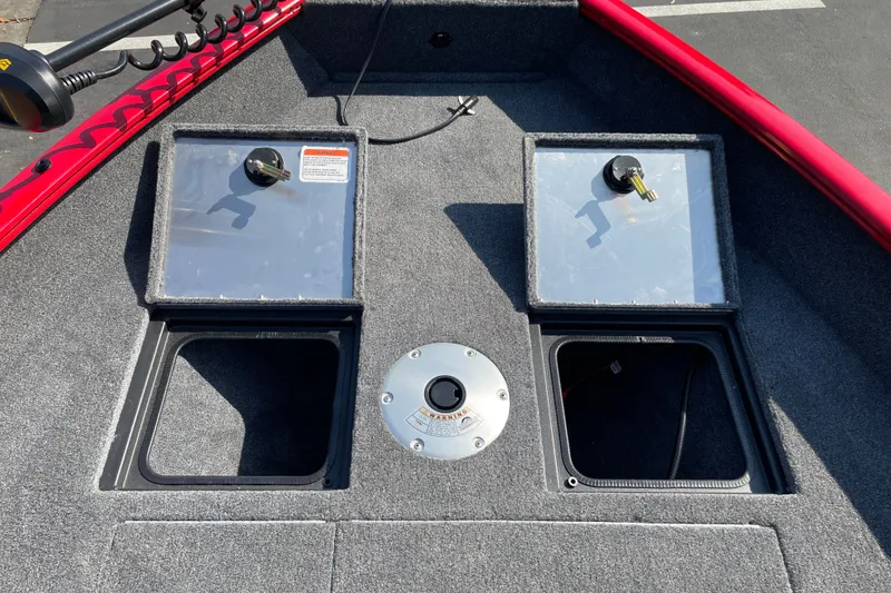 Slide: The Image of 2026 Tracker Pro Guide V-16 WT boat deck with storage compartments and trolling motor. - 15