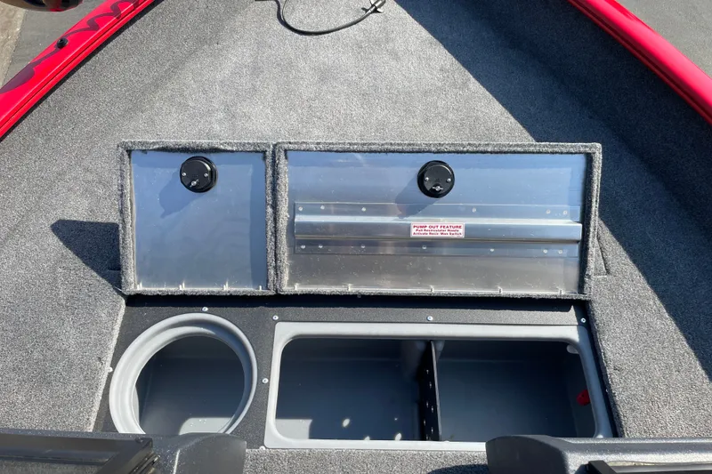 Slide: The Image of 2026 Tracker Pro Guide V-16 WT boat storage compartments with pump-out feature. - 17