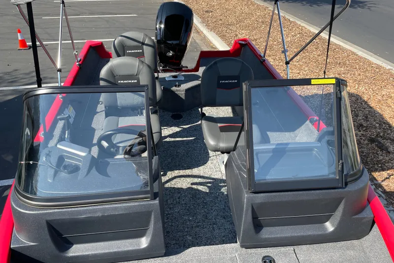 Slide: The Image of 2026 Tracker Pro Guide V-16 WT boat interior with dual consoles and seating. - 19