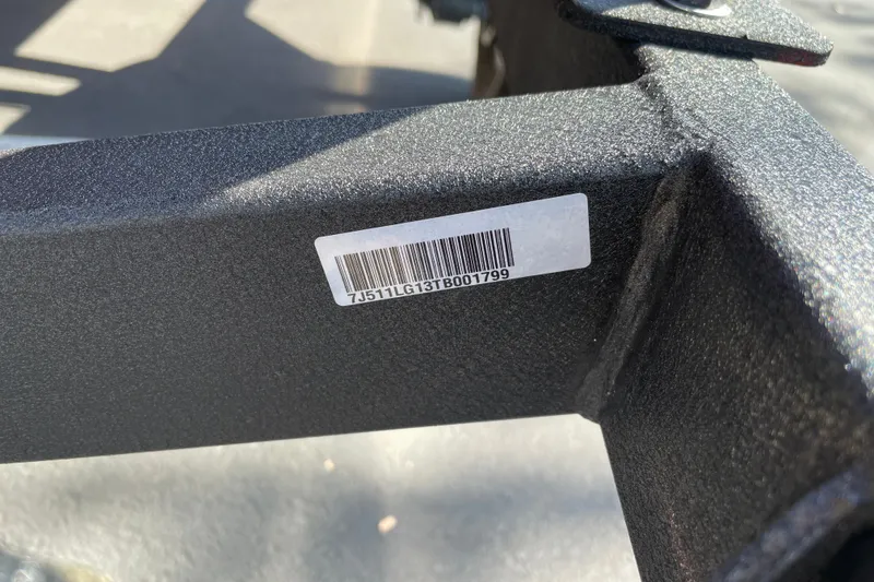 Slide: The Image of Barcode on a 2026 Tracker Pro Guide V-16 WT boat frame in sunlight. - 24