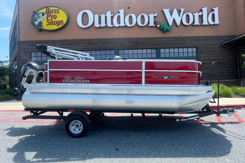 The Image of 2026 Sun Tracker Party Barge 18 DLX pontoon boat outside Bass Pro Shops Outdoor World. - 0
