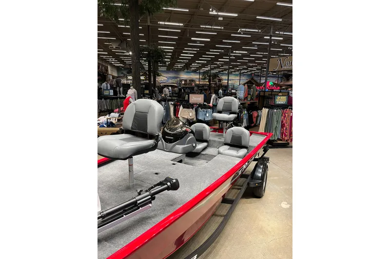 Slide: The Image of 2026 Tracker Pro 170 boat displayed in a store, featuring gray seating and red exterior. - 5