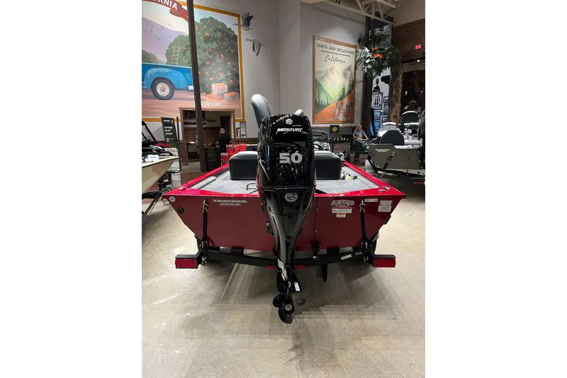 Slide: The Image of 2026 Tracker Pro 170 boat with Mercury 50 engine displayed indoors. - 3