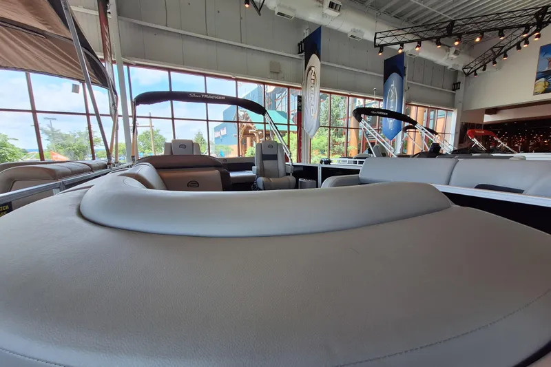 Slide: The Image of 2026 Sun Tracker Party Barge 22 RF DLX interior in showroom setting. - 89