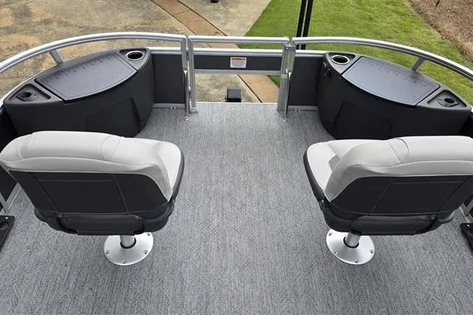 Slide: The Image of 2026 Sun Tracker Bass Buggy 18 DLX pontoon boat with swivel seats and carpeted deck. - 8