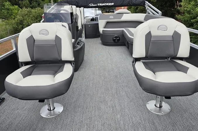 Slide: The Image of 2026 Sun Tracker Bass Buggy 18 DLX pontoon boat interior with gray and white seating. - 11