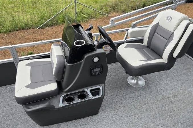 Slide: The Image of 2026 Sun Tracker Bass Buggy 18 DLX boat interior with steering console and seating. - 9