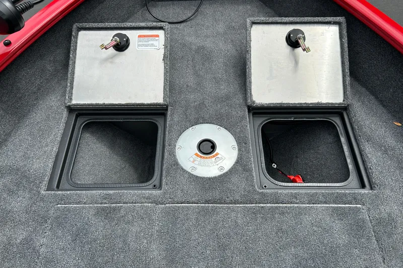 Slide: The Image of 2026 Tracker Pro Guide V-16 WT boat storage compartments and access panel. - 18