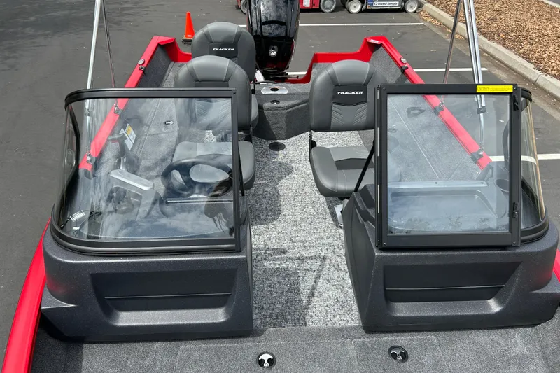 Slide: The Image of 2026 Tracker Pro Guide V-16 WT boat interior with dual consoles and seating. - 20