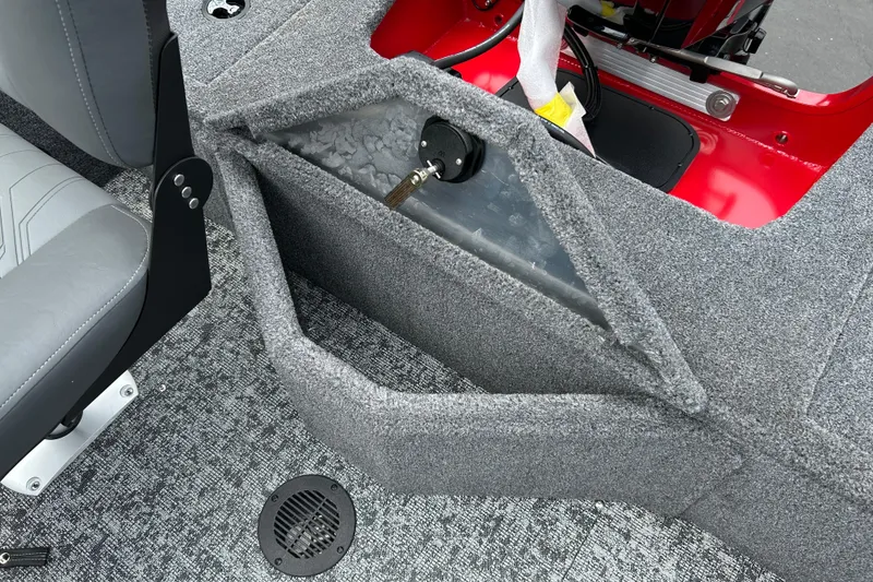 Slide: The Image of 2026 Tracker Pro Guide V-16 WT boat interior with gray seating and storage compartment. - 13