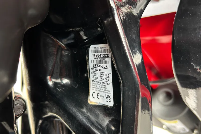 Slide: The Image of Close-up of a 2026 Tracker Pro Guide V-16 WT model number label. - 70