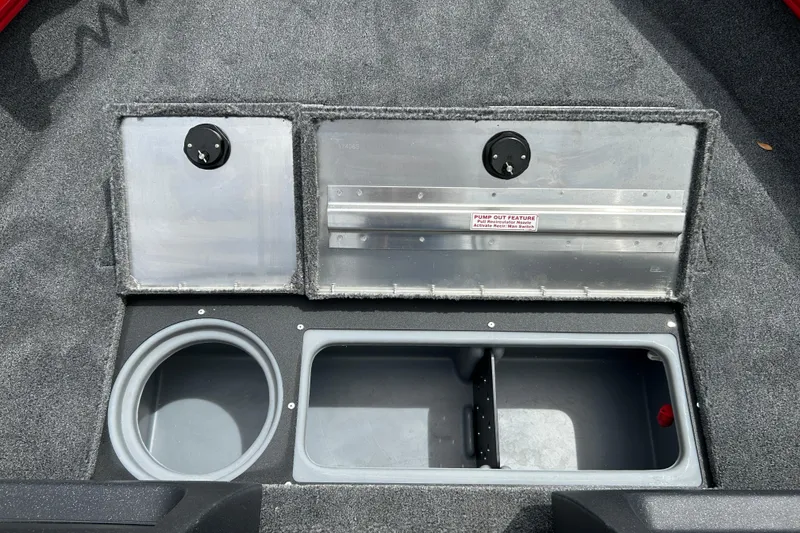 Slide: The Image of 2026 Tracker Pro Guide V-16 WT boat storage compartments with pump-out feature. - 19