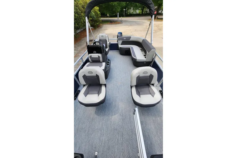 Slide: The Image of 2026 Sun Tracker Bass Buggy 16 XL Select pontoon boat interior with seating and helm. - 5