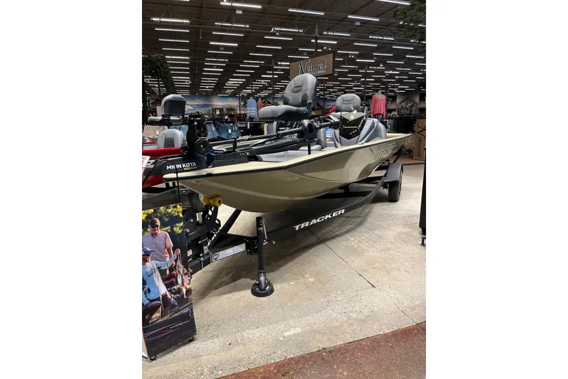 The Image of 2026 Tracker Pro Team 175 boat displayed indoors with fishing equipment. - 0