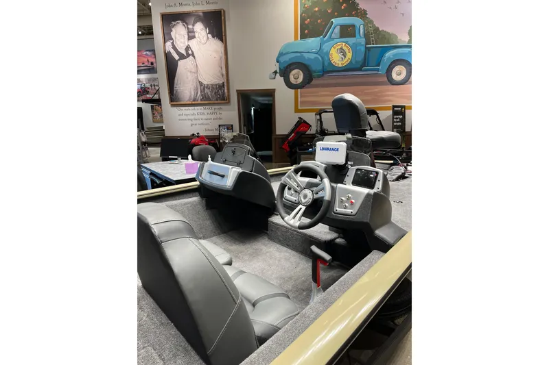 Slide: The Image of 2026 Tracker Pro Team 175 boat interior with steering wheel and control panel. - 4