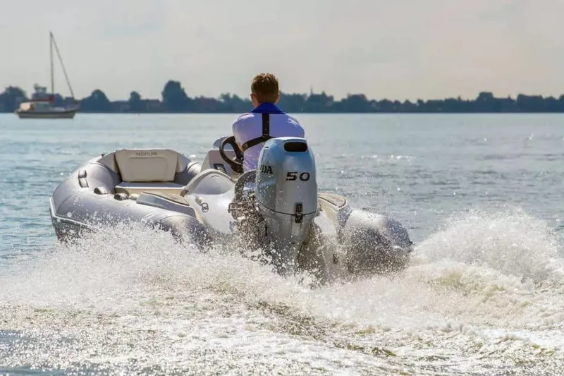 The Image of 2026 Zodiac Yachtline 360 cruising on water with powerful outboard motor. - 0