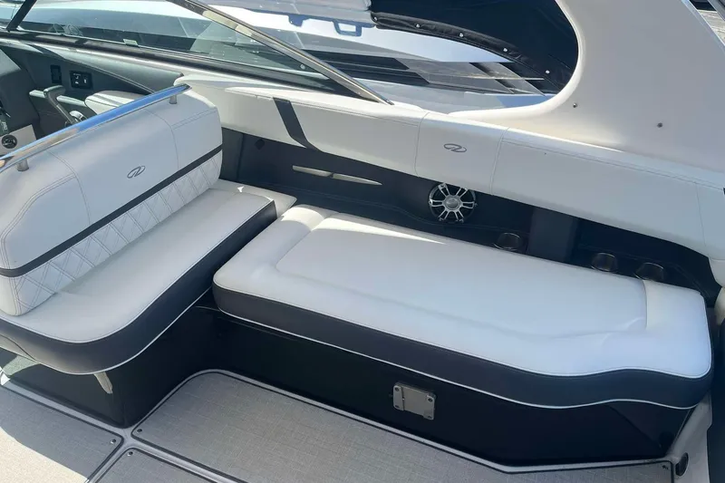 Slide: The Image of Luxurious seating in 2023 Regal 2800 Bowrider boat, featuring sleek white upholstery. - 10