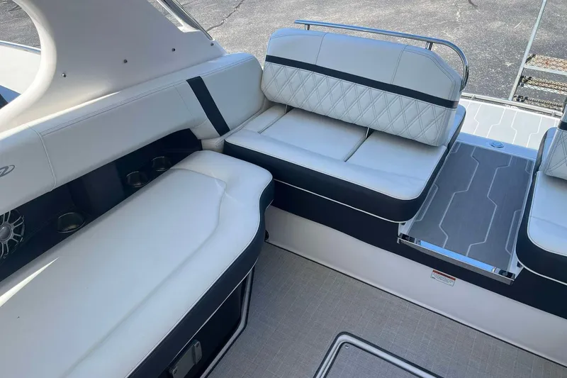 Slide: The Image of 2023 Regal 2800 Bowrider interior with white cushioned seating and modern design. - 11