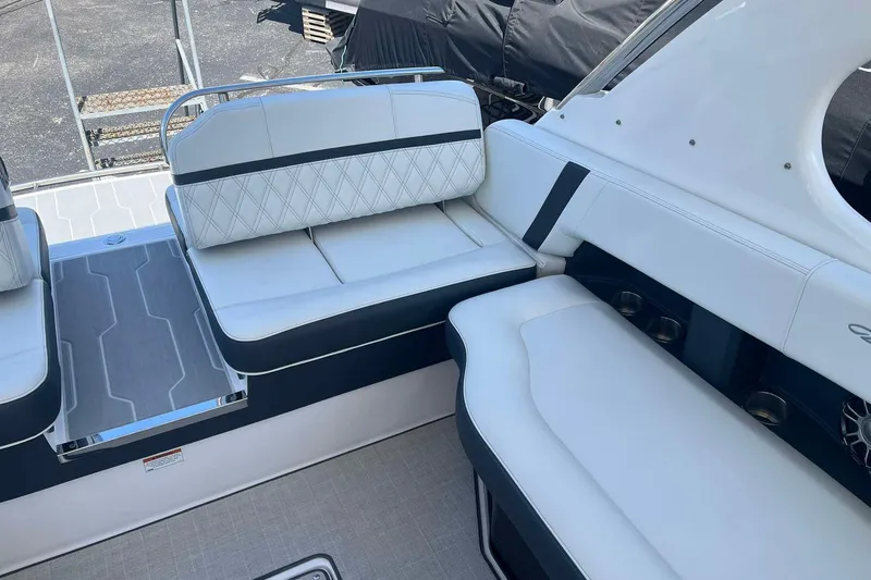 Slide: The Image of 2023 Regal 2800 Bowrider interior with luxurious white seating and modern design. - 12