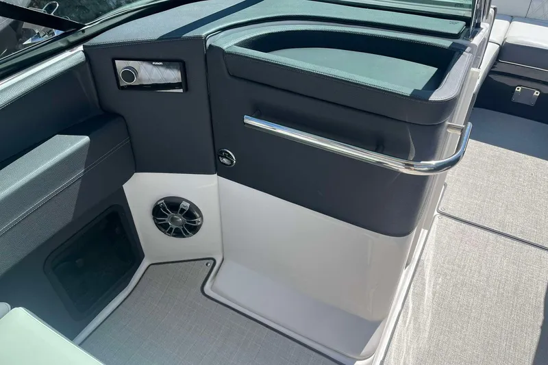 Slide: The Image of Interior of 2023 Regal 2800 Bowrider boat with speaker and storage compartment. - 14
