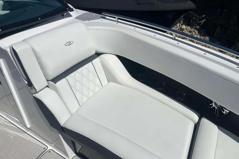 Slide: The Image of Luxurious seating on 2023 Regal 2800 Bowrider boat, featuring elegant white upholstery. - 18