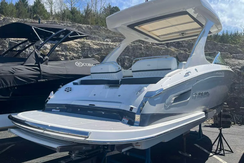 Slide: The Image of 2023 Regal 2800 Bowrider boat displayed outdoors, showcasing sleek design and spacious seating. - 3