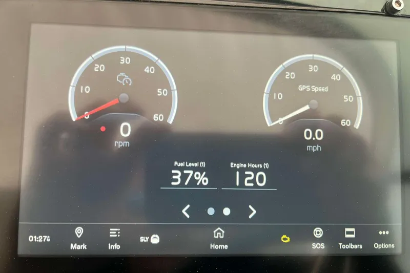 Slide: The Image of Dashboard of 2023 Regal 2800 Bowrider showing 37% fuel, 120 engine hours. - 7