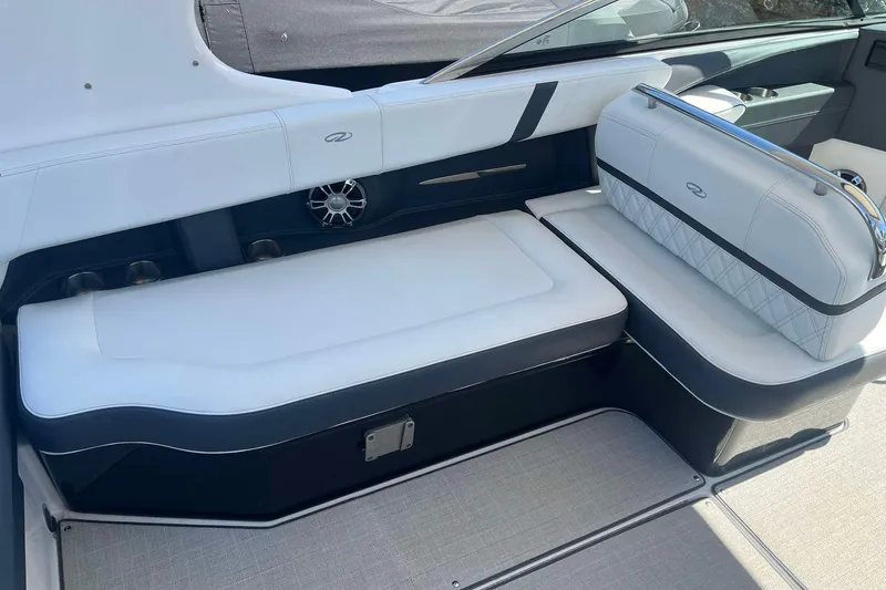 Slide: The Image of 2023 Regal 2800 Bowrider interior with white cushioned seating and sleek design. - 9