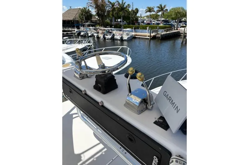 Slide: The Image of Steering console of 1992 Tiara Yachts 3600 Open with Garmin navigation, dockside view. - 5