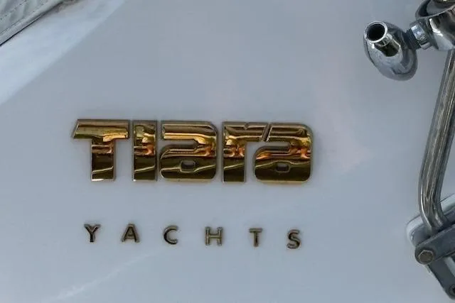 Slide: The Image of Gold "Tiara Yachts" logo on a 1992 Tiara 3600 Open yacht. - 7