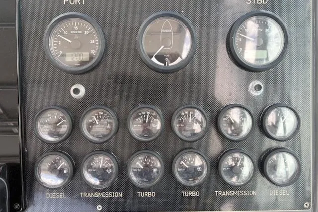Slide: The Image of Dashboard of a 1992 Tiara Yachts 3600 Open with various gauges and indicators. - 8