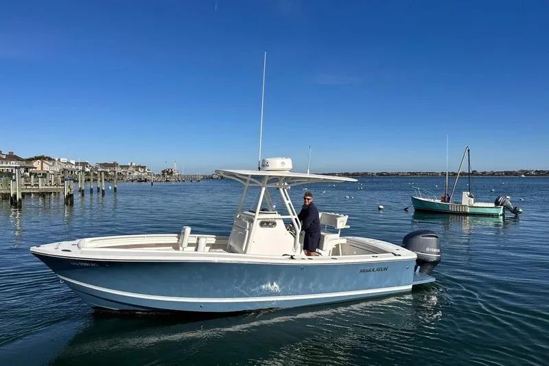 The Image of 2017 Regulator 23 boat on calm water with clear blue sky background. - 0